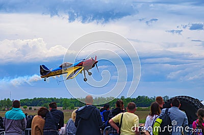 Third AirFestival at Chaika airfield. The plane flies very close to the audience, who watched the performance of the pilot Editorial Stock Photo