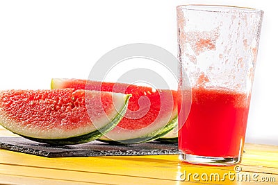 Thirst quenching healthy summer fruit drink. Refreshing watermelon slices and smoothie. Stock Photo