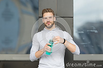 Thirsty concept. Young guy look thirsty. Thirsty man hold water bottle. A drop of water is life for a thirsty person Stock Photo