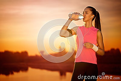 Thirsty female runner Stock Photo