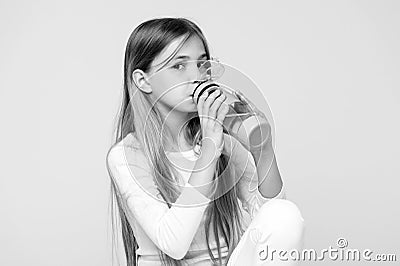 Thirsty kid drink water for health on pink background. Child hold water bottle. Little girl with plastic bottle. Thirst Stock Photo