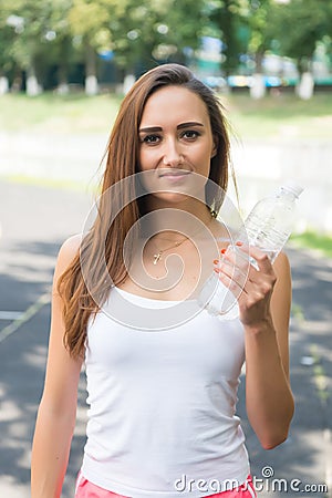Thirsty woman holds water bottle. Thirst and water balance concept. Signs you definitely need pay attention your body Stock Photo