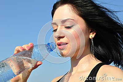 Thirsty young woman Stock Photo