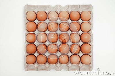 Thirty eggs in a paper tray on a white background Stock Photo