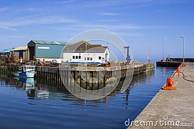 Thje harbour enrtance of Kilkeel Harbour in County Down Northern Ireland on a beautiful summer`s day Editorial Stock Photo
