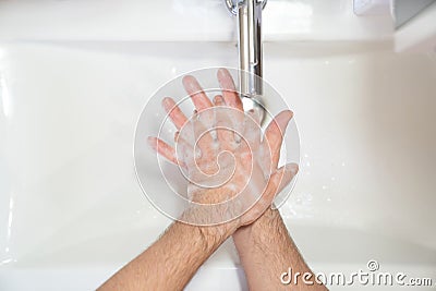 Thorough washing of men hands soap foam and water Stock Photo