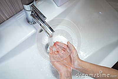Thorough washing of women hands soap and water Stock Photo