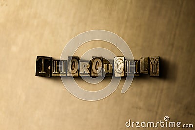 THOROUGHLY - close-up of grungy vintage typeset word on metal backdrop Cartoon Illustration