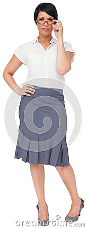 Thoughtful brown haired businesswoman in skirt Stock Photo