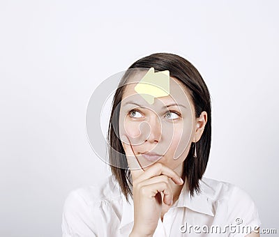 Thoughtful business woman with to do list Stock Photo