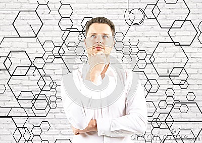 Thoughtful businessman with honeycombs Stock Photo