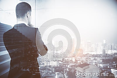 Thoughtful businessman with stairs Stock Photo