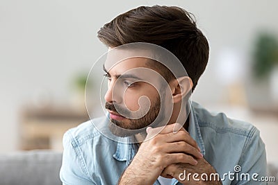 Thoughtful concerned man thinking about problem solution lost in thoughts Stock Photo