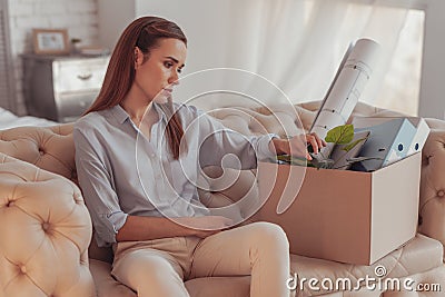 Thoughtful dispirited woman on the sofa Stock Photo