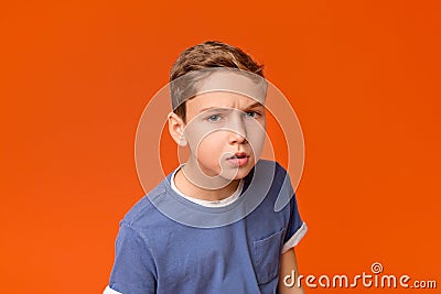 Thoughtful dissatisfied curious teen boy closeup portrait Stock Photo