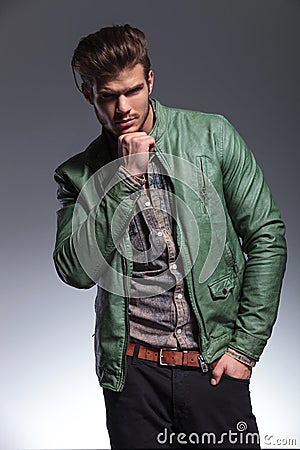 Thoughtful fashion man in leather jacket Stock Photo