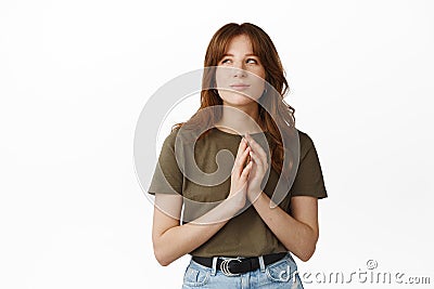 Thoughtful girl genius, steeple fingers and smirk, looking aside pleased, have interesting idea, great plan, scheming Stock Photo