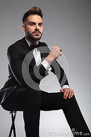Thoughtful groom looking away while wearing tuxedo Stock Photo