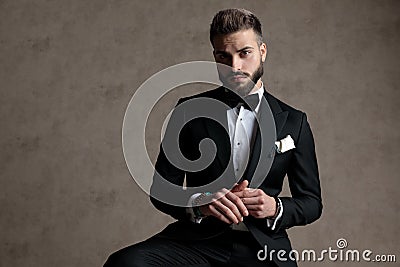 Thoughtful groom looking forward and wondering Stock Photo