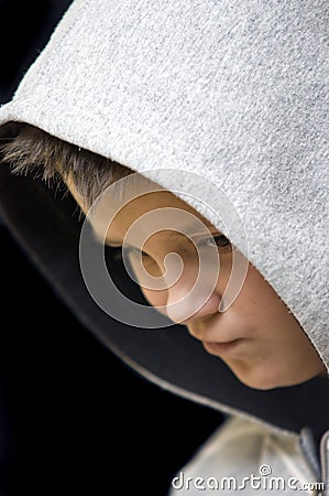 Thoughtful hooded teenage boy Stock Photo