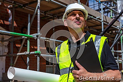 Thoughtful Male Builder Architect Construction Worker on Building Site Stock Photo