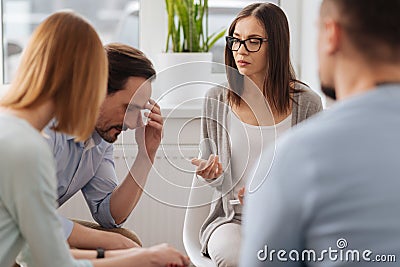 Thoughtful man listening to his colleagues Stock Photo