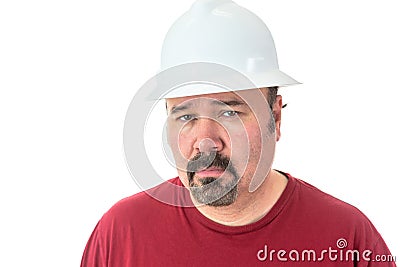 Thoughtful man wearing a hardhat Stock Photo