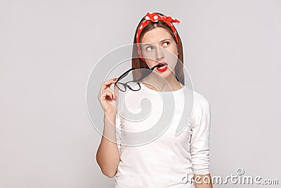 Thoughtful portrait of beautiful emotional young woman in white Stock Photo