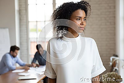 Pensive biracial woman look in distance thinking Stock Photo