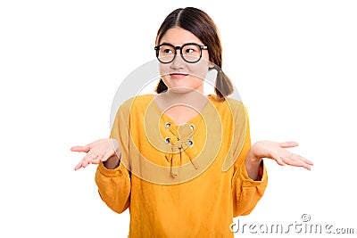 Thoughtful young beautiful Asian woman looking confused Stock Photo