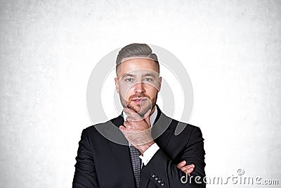 Thoughtful young businessman portrait, concrete Stock Photo