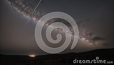 A Thoughtfully Introspective Image Of A Night Sky With A Plane Streak Stock Photo