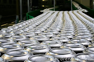 Thousands of beverage aluminum cans on conveyor line at factory Stock Photo
