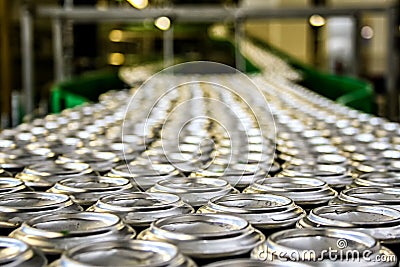 Thousands of beverage aluminum cans on conveyor line at factory Stock Photo