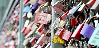 A thousands of colourful Love padlocks onthe Hohenzollern Bridge in Cologne, Germani Editorial Stock Photo