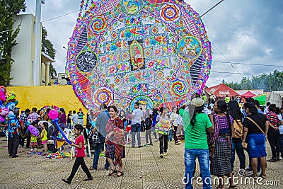 Thousands of people looking at the colorful kites with figures of the Virgin of Guadalupe Editorial Stock Photo