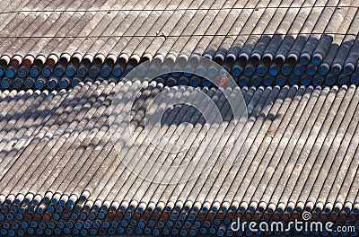 Thousands of pipes on the barge and man Editorial Stock Photo