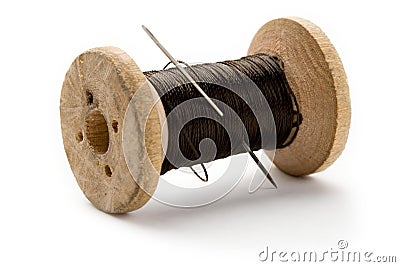 Thread bobbin and needle Stock Photo