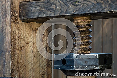 Thread cutting bolt wooden parallel row revolution abstract rustic texture part of the mechanism fixation Stock Photo