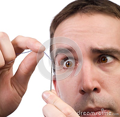 Threading A Needle Stock Photo