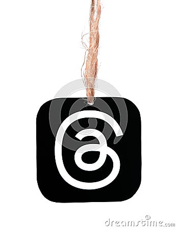 Threads mobile app icon hanging on sackcloth thread on white background close-up. Meta Officially Launches Threads which Editorial Stock Photo