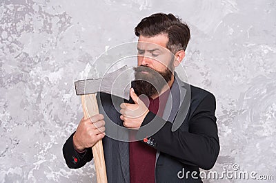 Threat to debtors. Brutal bearded man with axe. Debt collection is process of pursuing payments of debts owed by Stock Photo