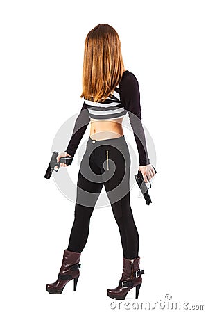 Threatening and woman with guns is walking Stock Photo