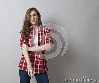 Threatening woman with male shirt expressing self-assertion Stock Photo