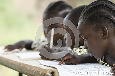 Three African children learning at school outdoors Stock Photo