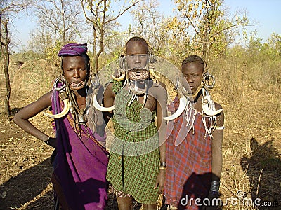 Three African grace of the Mursi Editorial Stock Photo