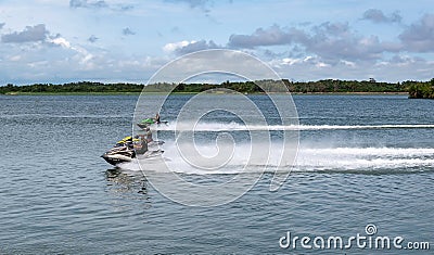 Three African men travel up river volta with water scooter Editorial Stock Photo