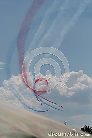 Airplanes making colorful smoke in formation Editorial Stock Photo