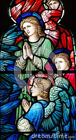 Three angels (praying) in stained glass Stock Photo