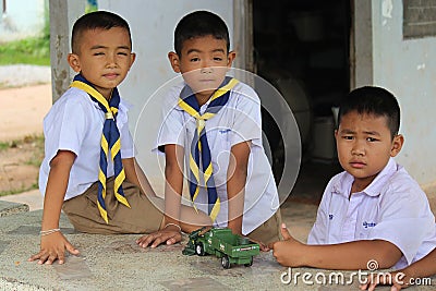 Three Asian children are playing together in lunch-break. Editorial Stock Photo